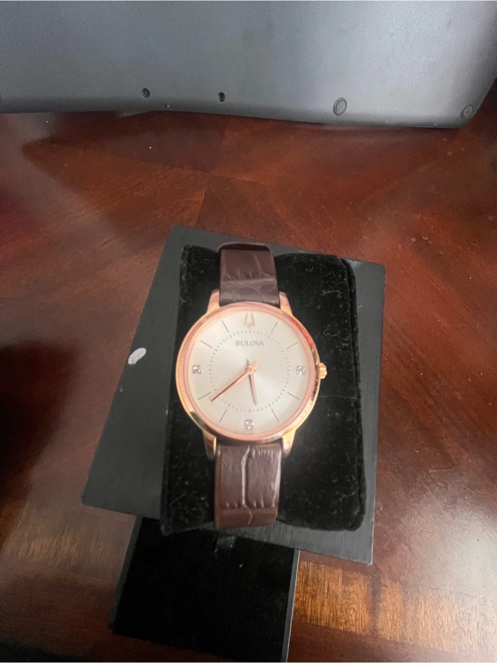 Bulova Women’s Brown Leather Strap Watch - Rose Gold Dial & 3 diamonds on face.